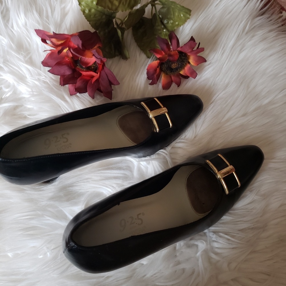 Black heels with gold buckle